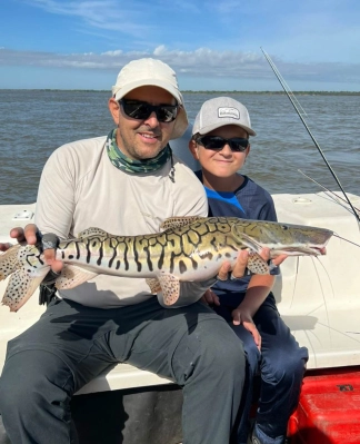 Sebastian and son with Barred Surubí Sebastian and son with Barred Surubí