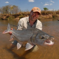 Jim Klug with a tigerfish Jim Klug with a tigerfish