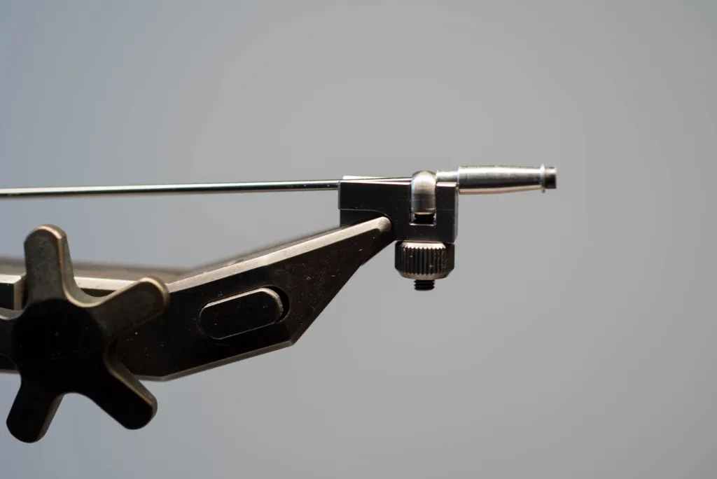 One metal tube in a vise adapter