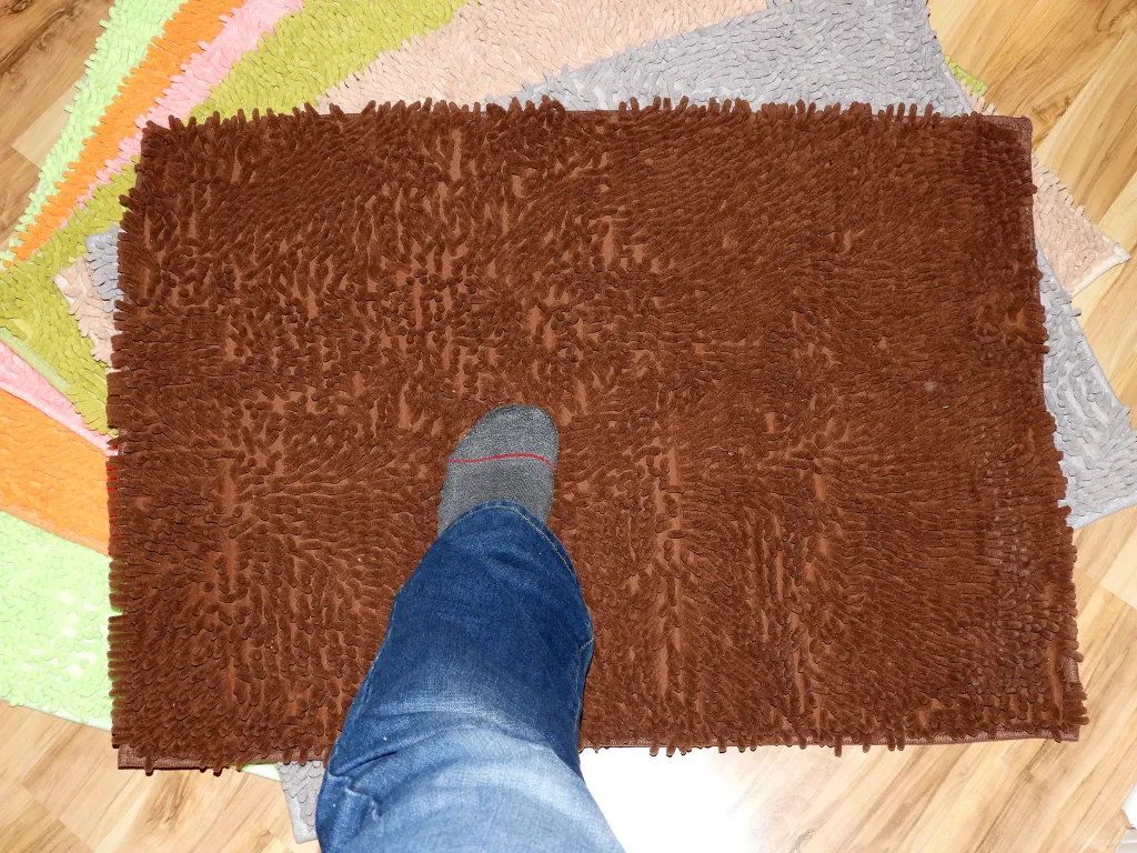 Foot on a bathroom mat